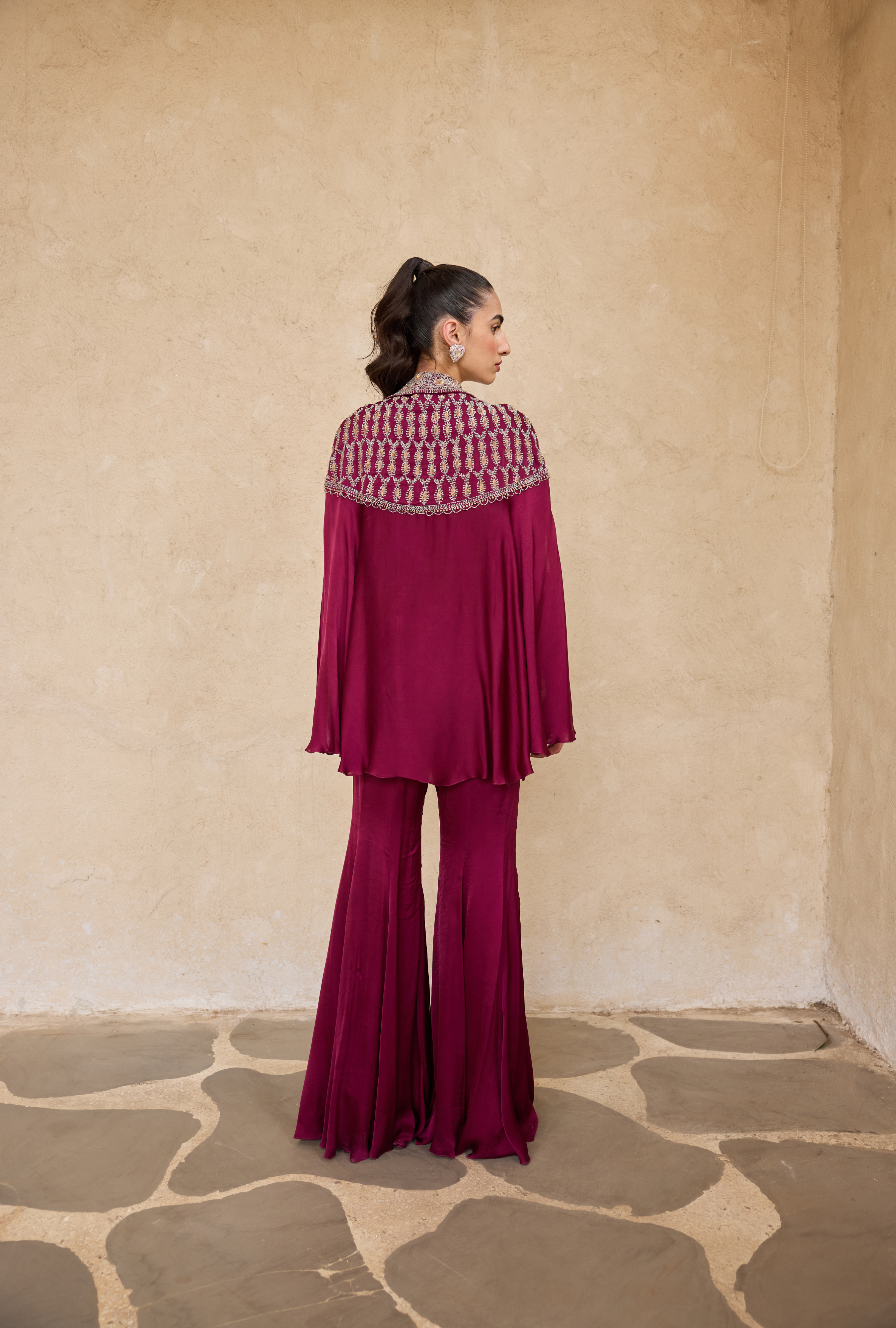 Modern Indian coord set in purple satin with dramatic flares
