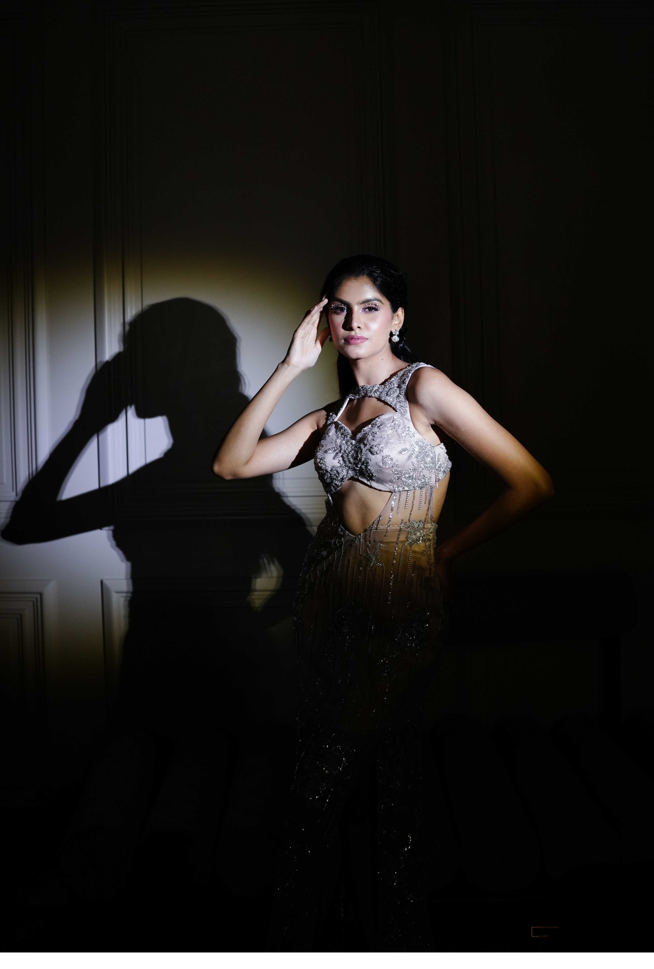 Silver embellished gown with side slit and fitted waist