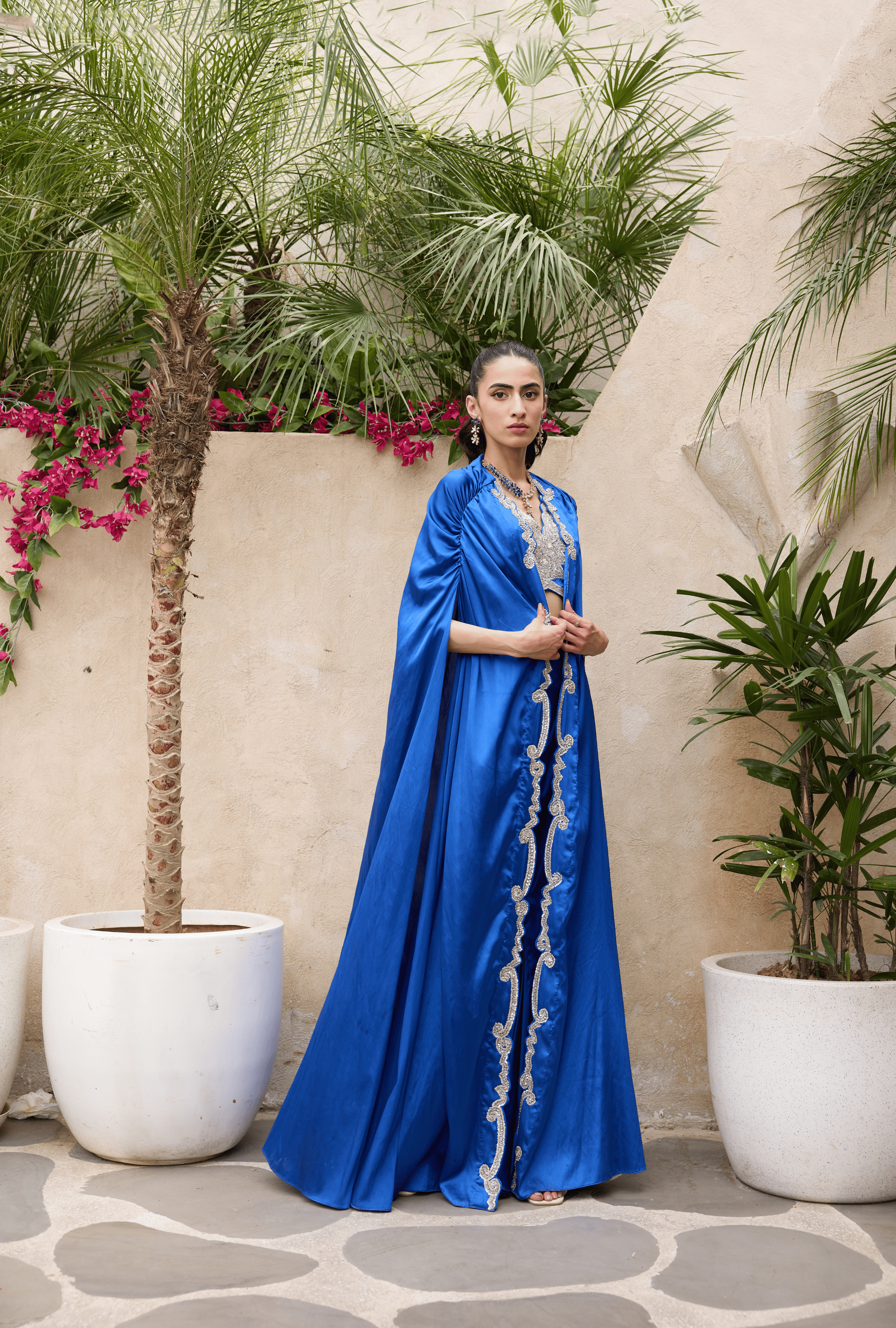 Elegant fashion designer outfit with gathered shoulders and detailing