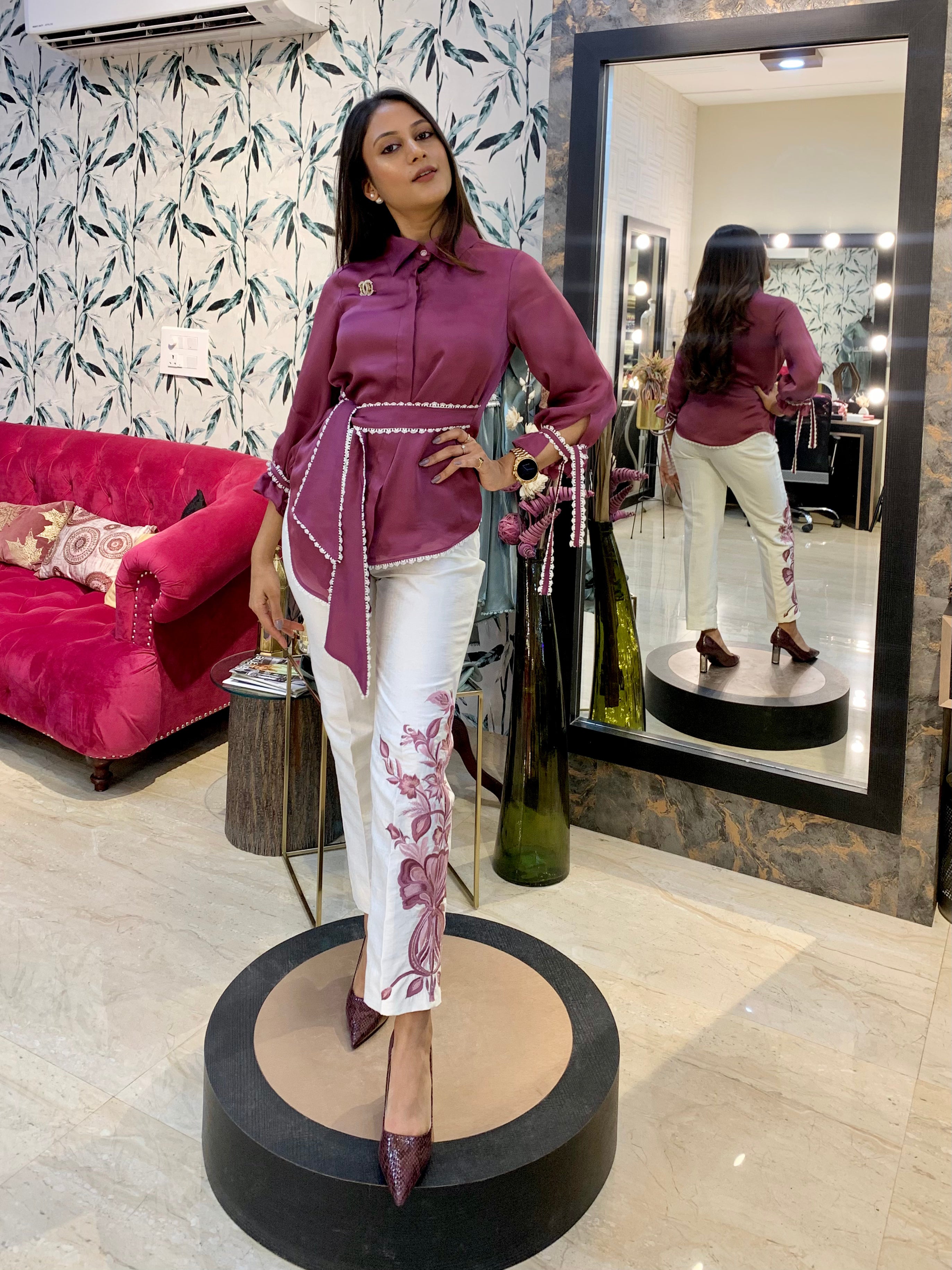 Model in mauve satin organza shirt with pearl belt and white cotton silk pants with floral embroidery – formalwear by Prisella