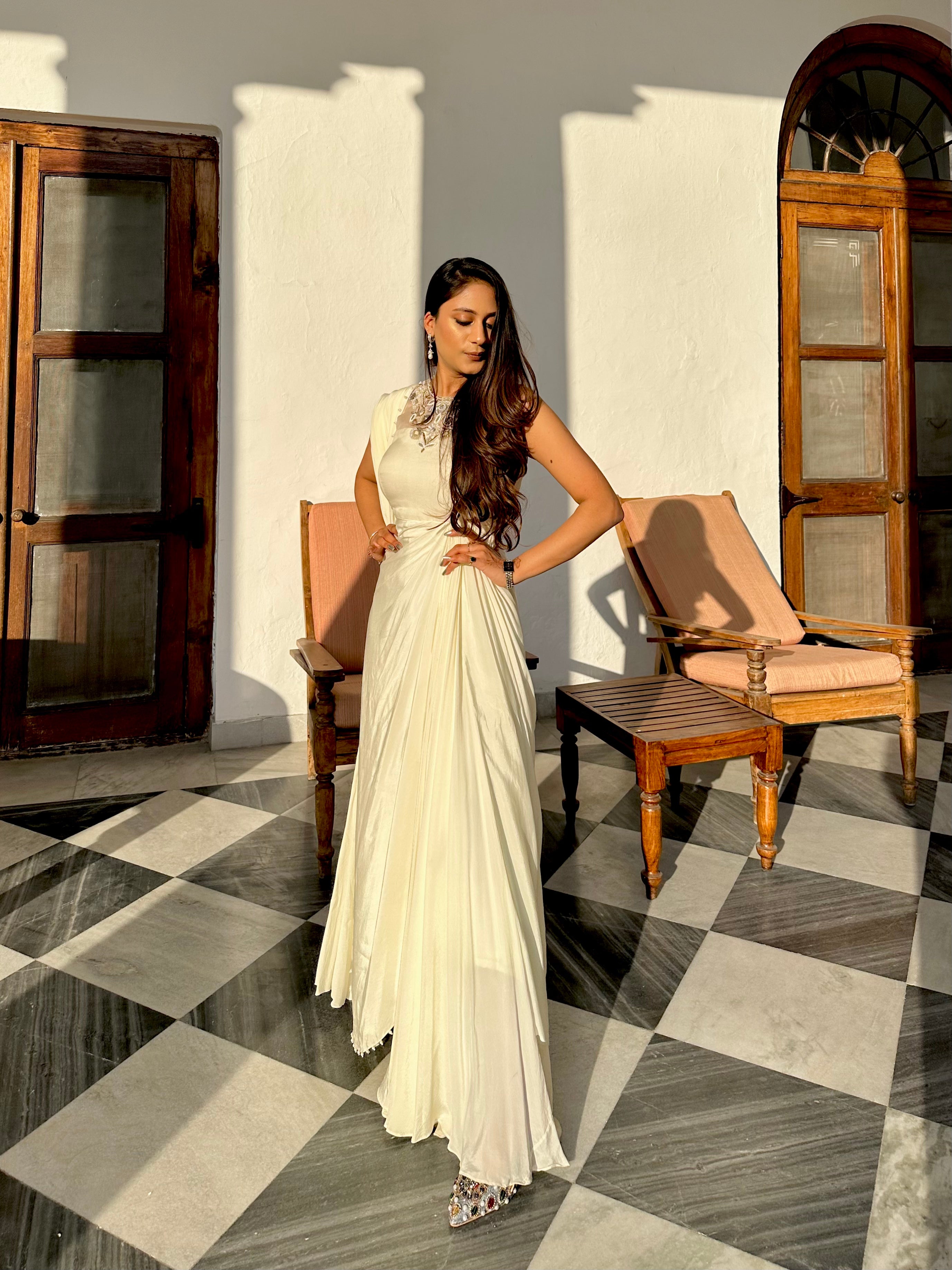 Woman in off-white embroidered ready-to-wear saree gown standing in sunlight – Prisella Occasion Wear