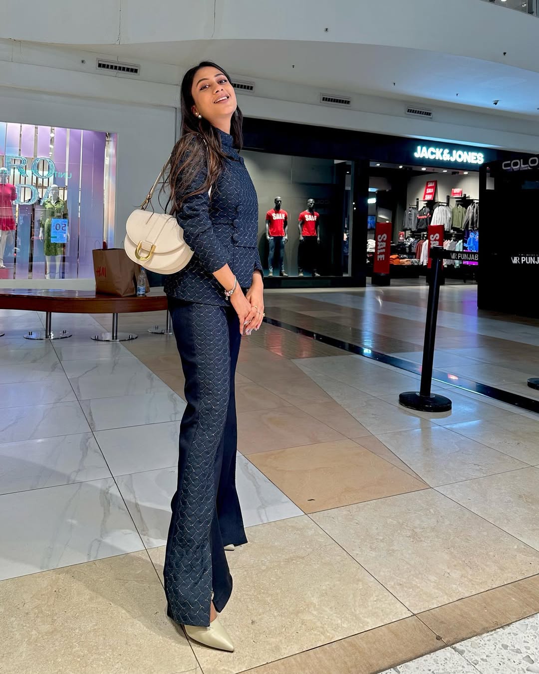 Stylish flared pants with slit paired with sculpted top