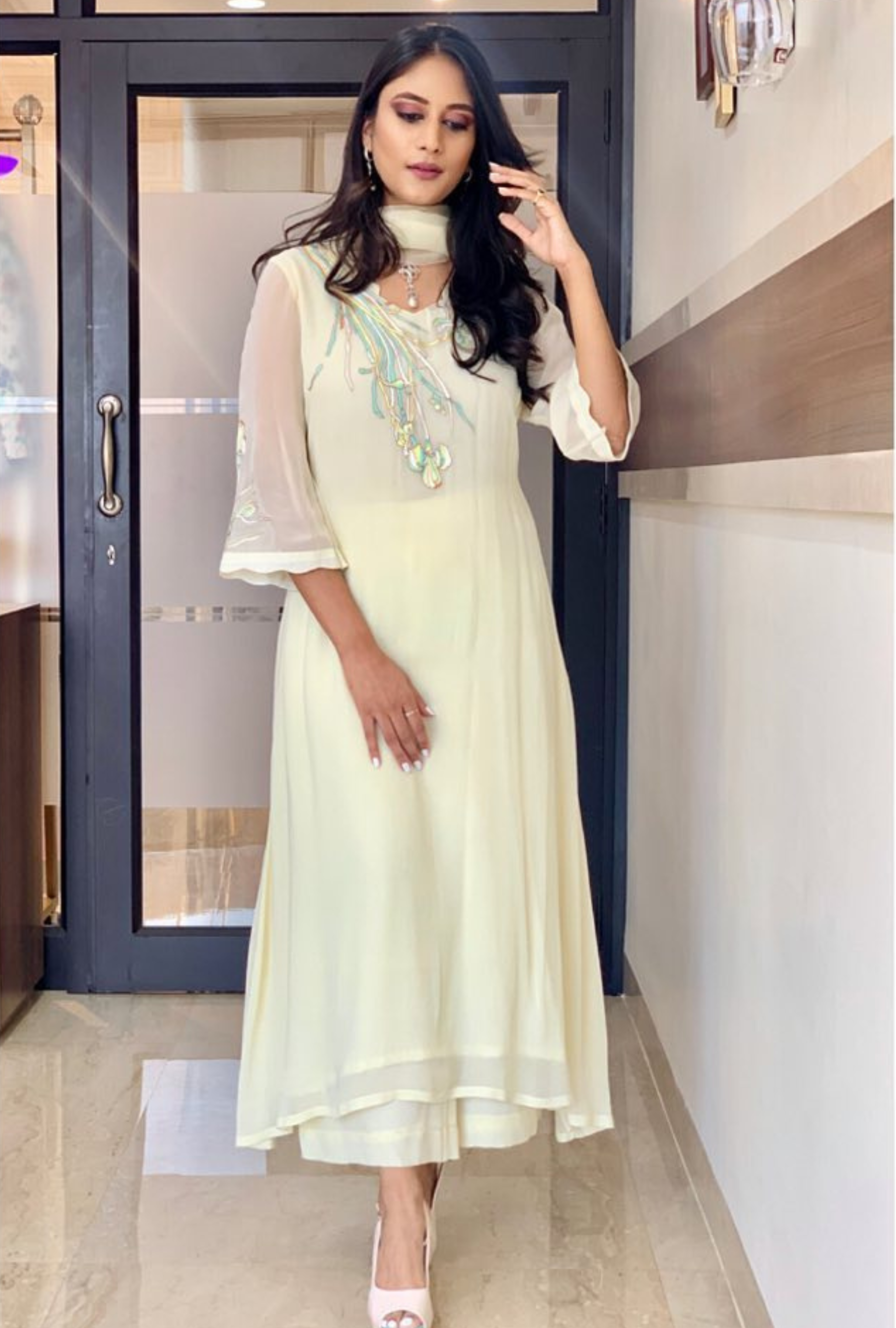 Woman wearing white embroidered suit set named Lemonade, styled with sheer sleeves and dupatta – Prisella casual ethnic wear