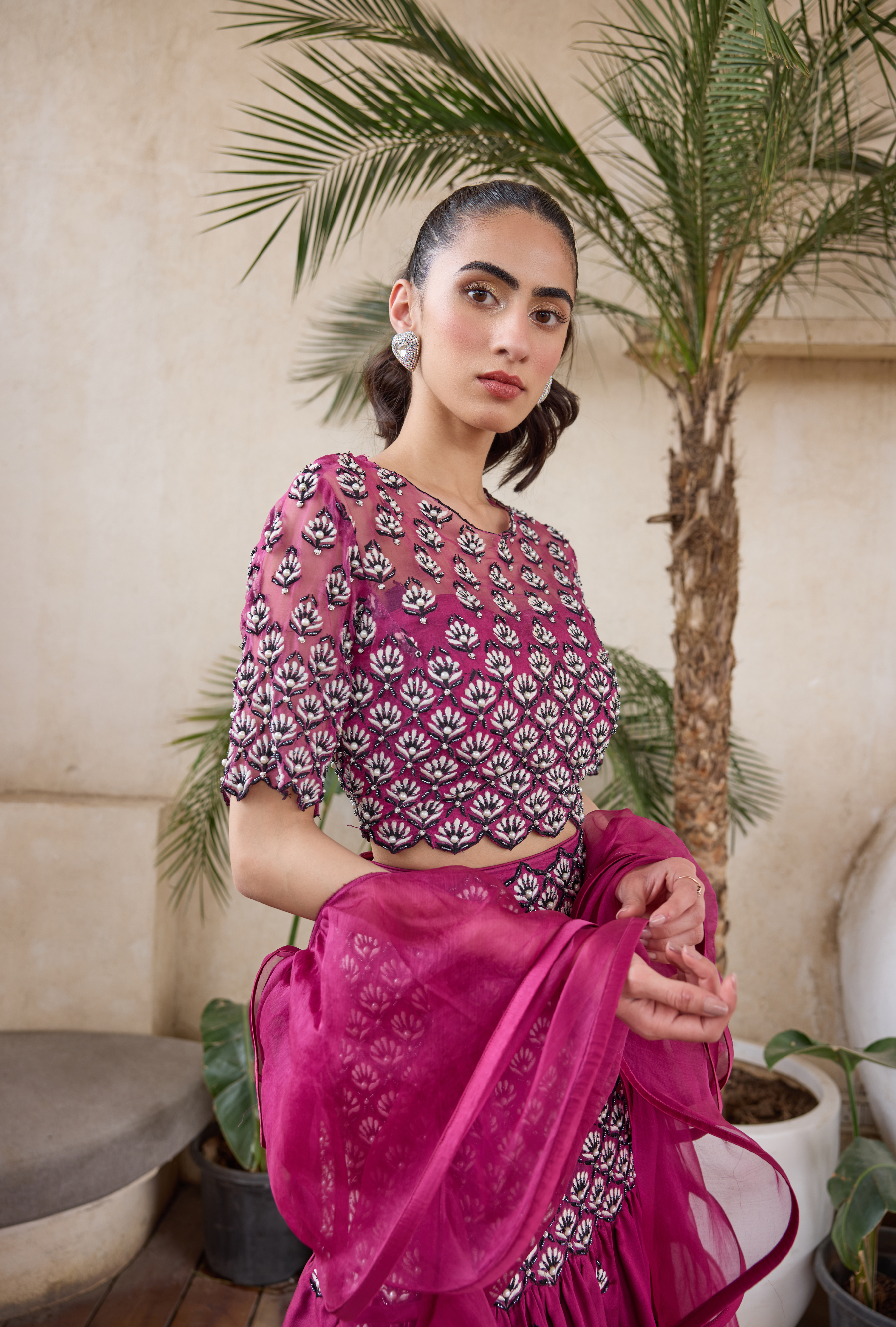 Elegant fuchsia lehenga with elbow-sleeve blouse and dupatta