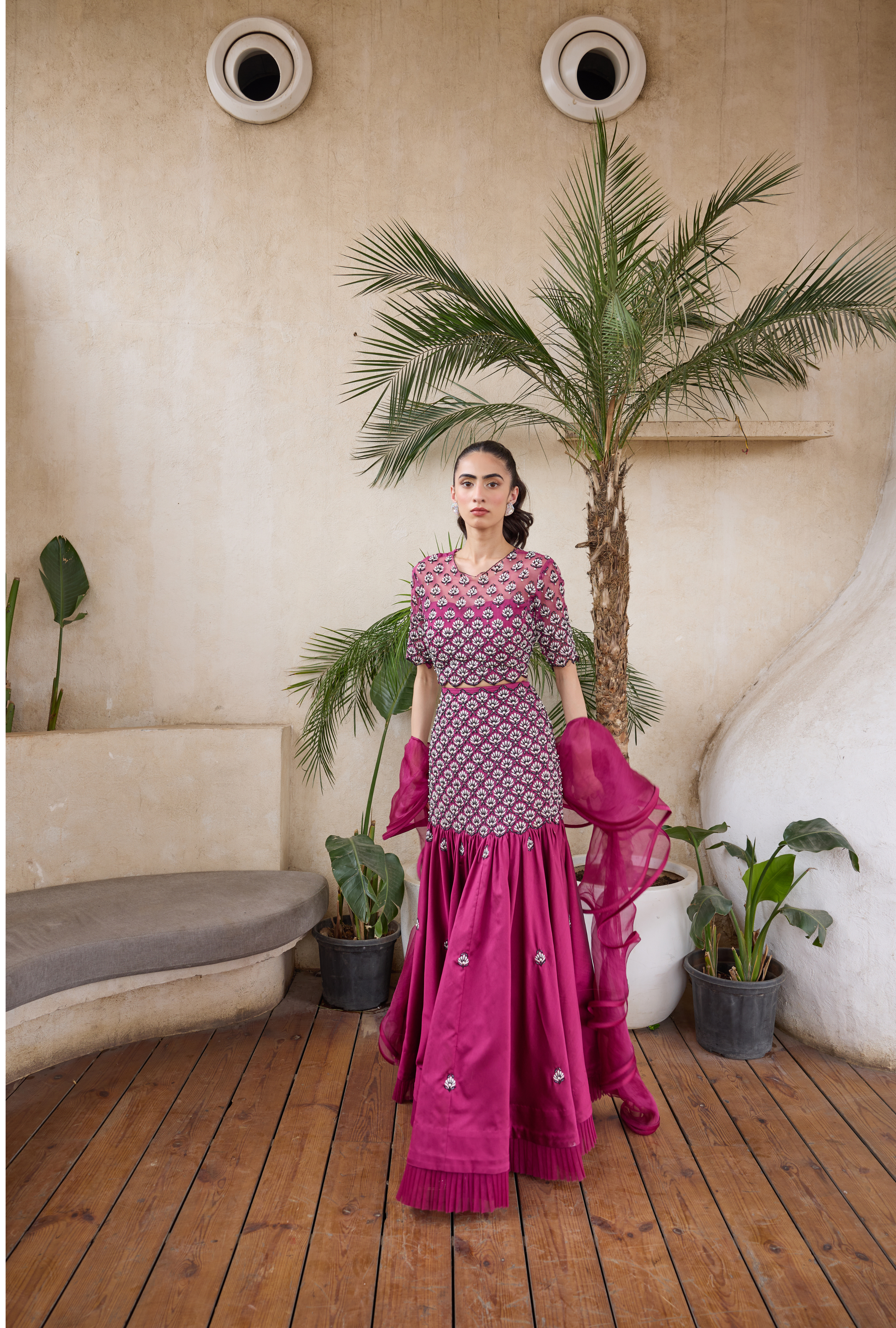 Elegant fuchsia lehenga with elbow-sleeve blouse and dupatta