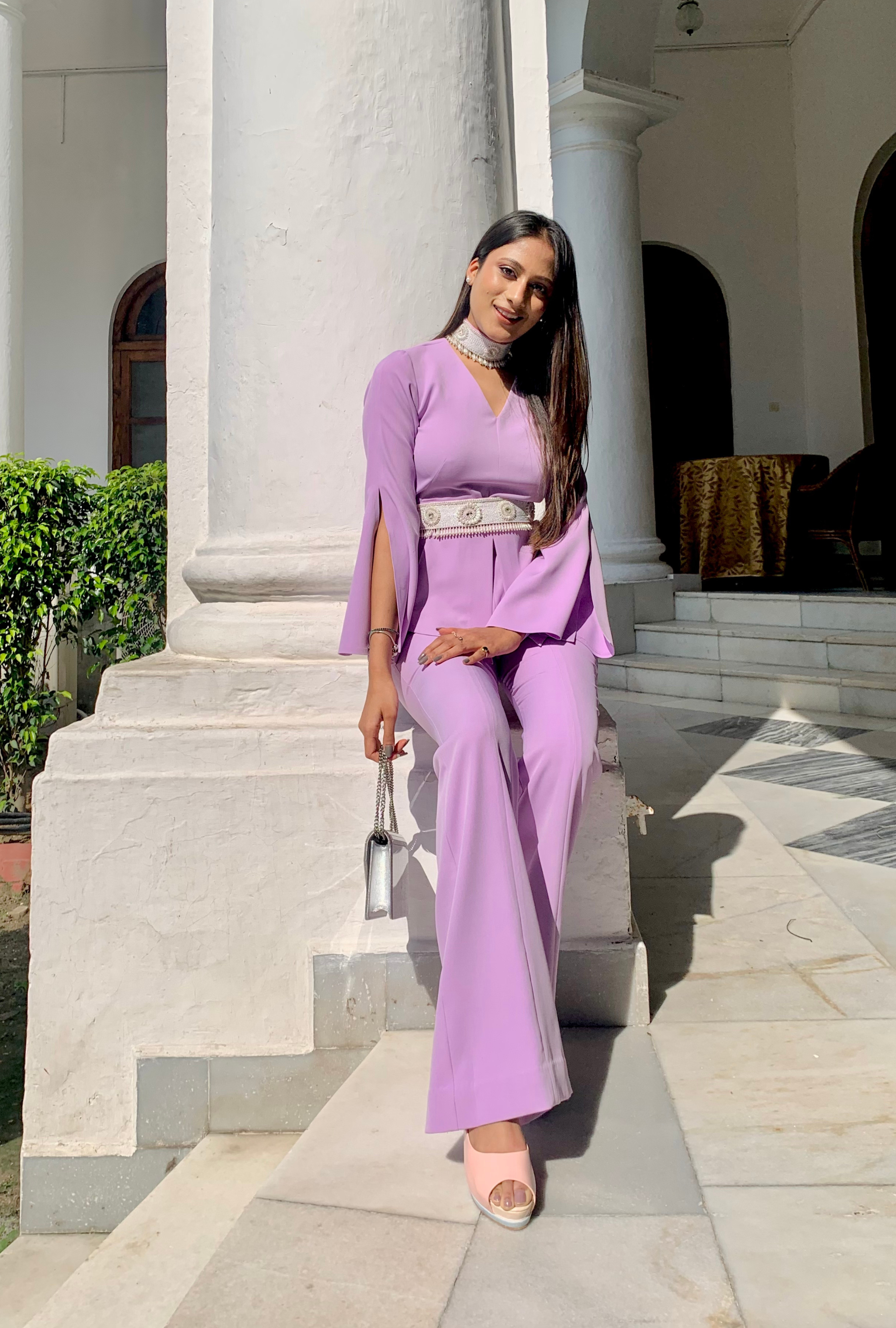 Model wearing lavender flared coord set with V-neck top, bell sleeves, and embellished belt – casual and vacation wear by Prisella. Shop now from Prisella website or Panchkula Store or Patiala Store
