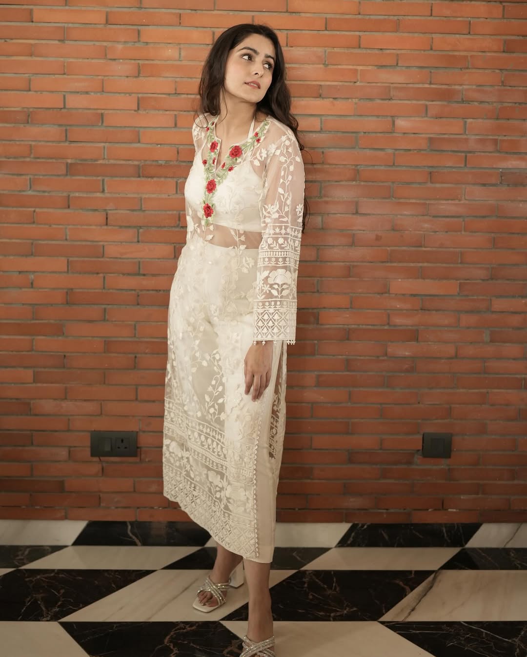 Model in a dark beige embroidered net shirt, cotton silk bandeau, and pants – Prisella festivewear ensemble