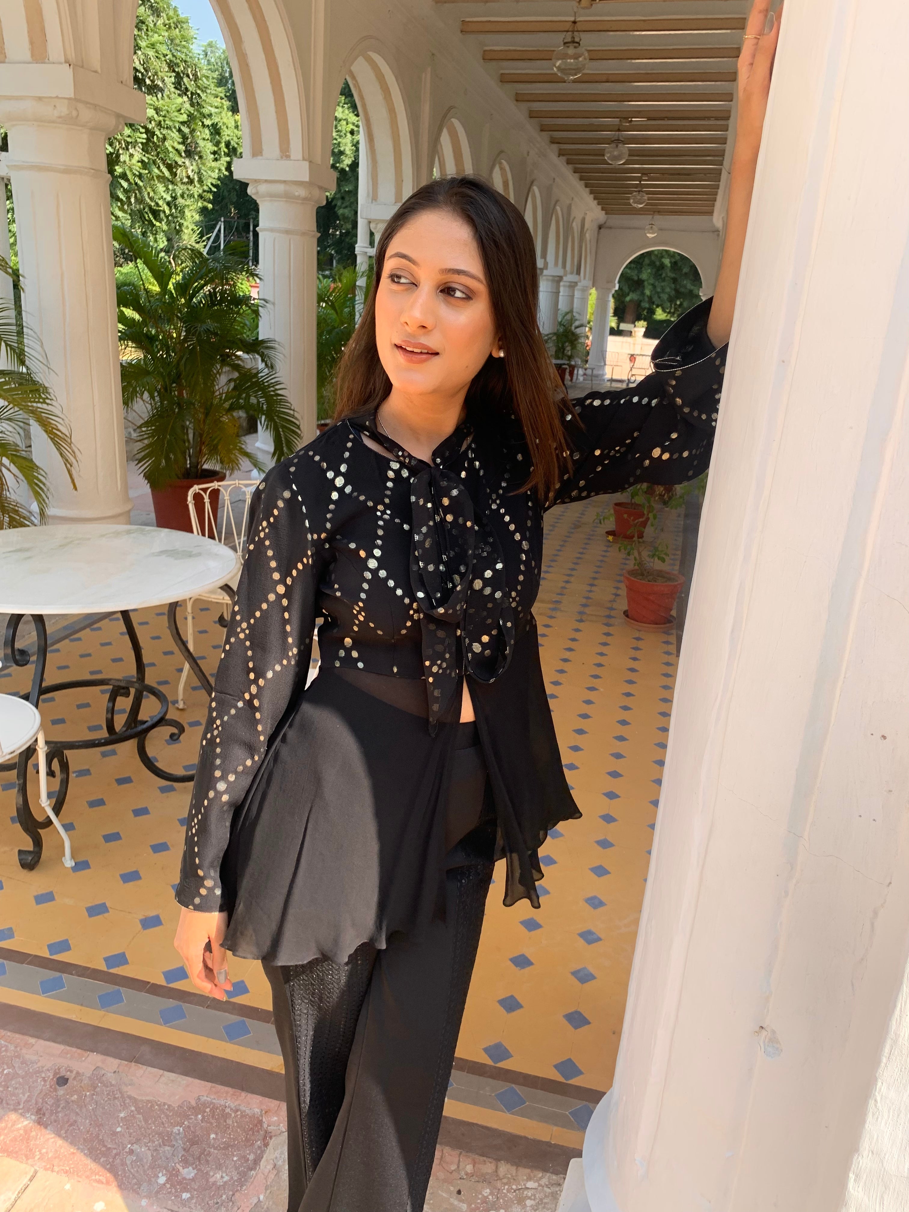 Evening black co-ord set with pearls and structured silhouette